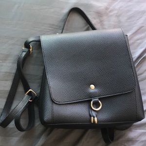 Black faux leather backpack